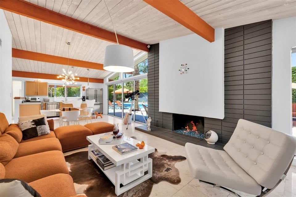 Living room with gas fireplace and flatscreen smart tv
