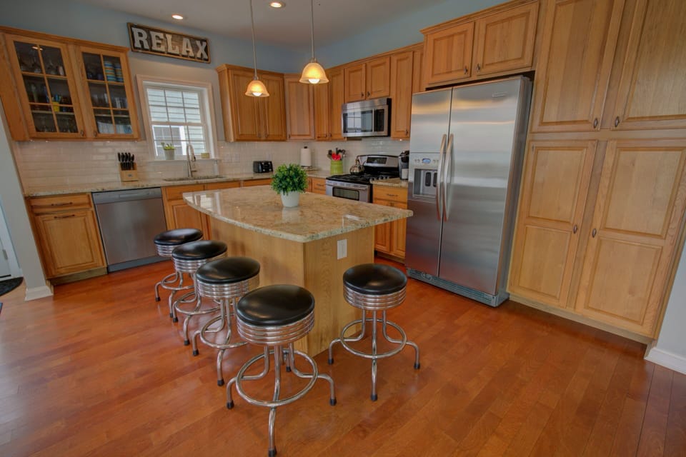 Five stools for extra seating around the large island