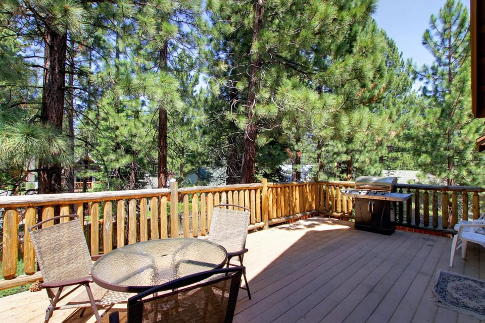 Enjoy a backyard barbecue on your upper deck w/ the gas grill & patio seating.