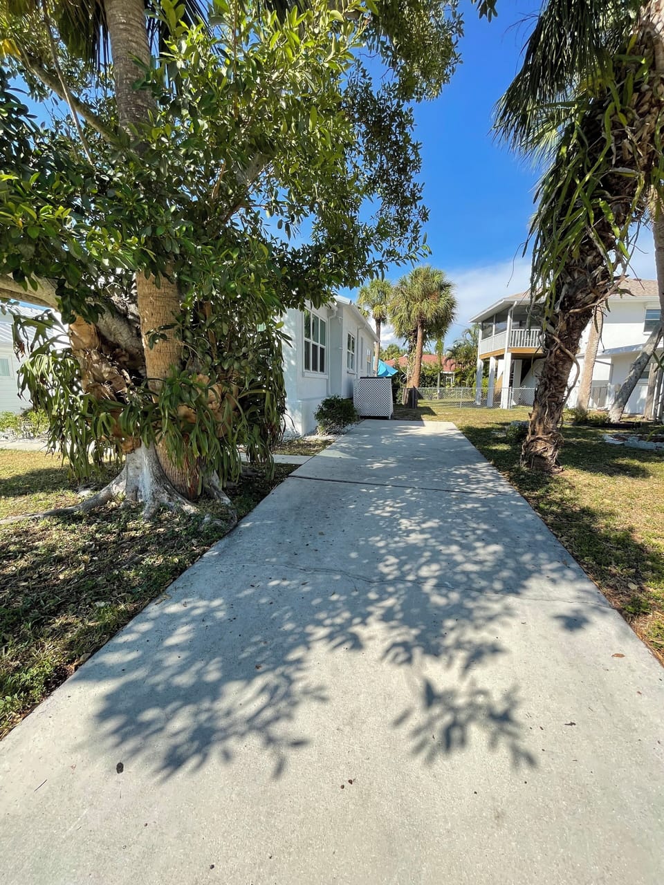 A true Siesta Key gem - Siesta Beach House.  1 of 2 driveways for ample parking