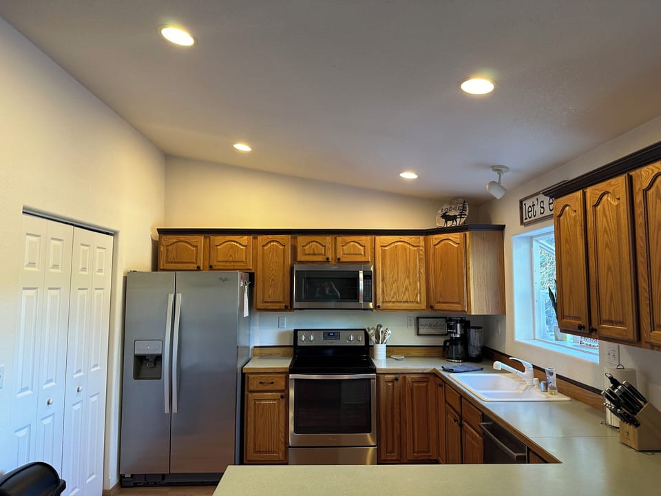 Well stocked kitchen with updated stainless appliances.