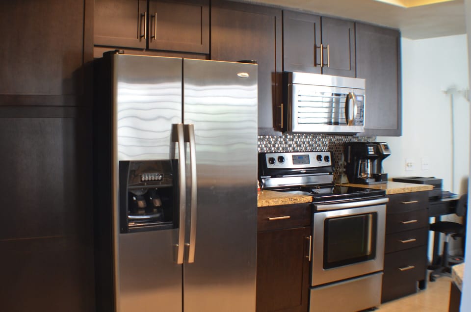 Kitchen features stainless appliances