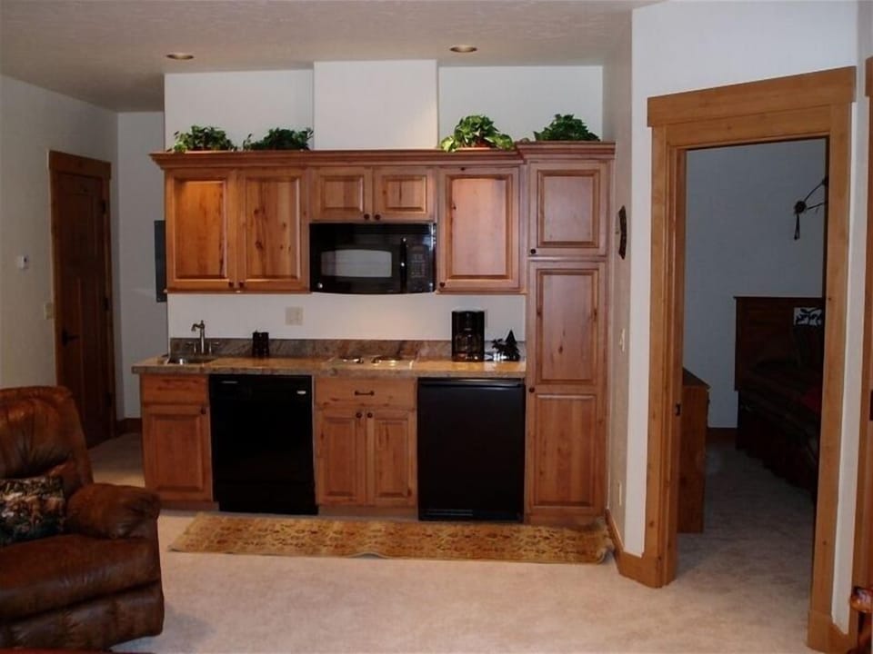 Fully Equipped Kitchenette with Bedroom entrance.