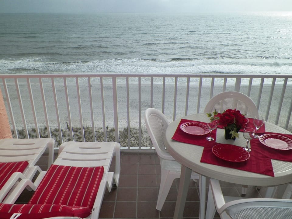 Relax on the balcony with a direct view of the beach.