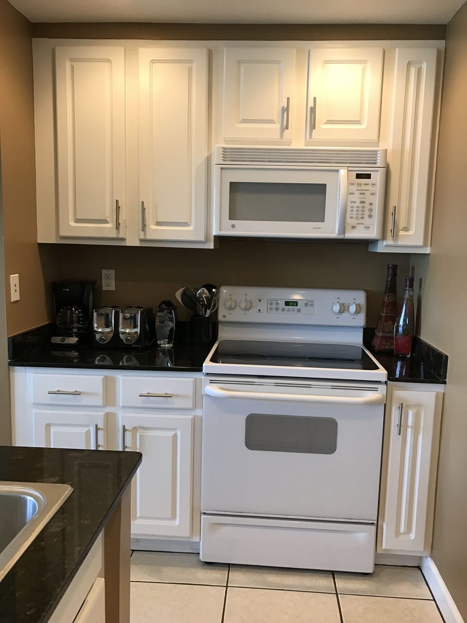 Fully equipped Kitchen with Pot and Pans, Plates, Glasses, and Silverware etc.