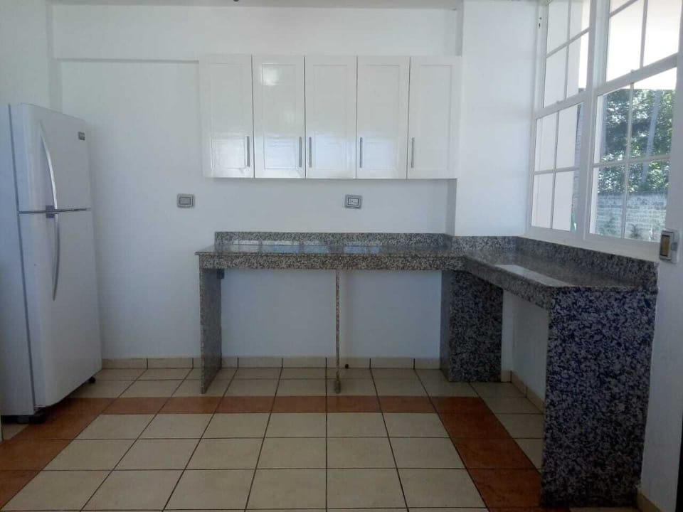 Another view of the kitchen area