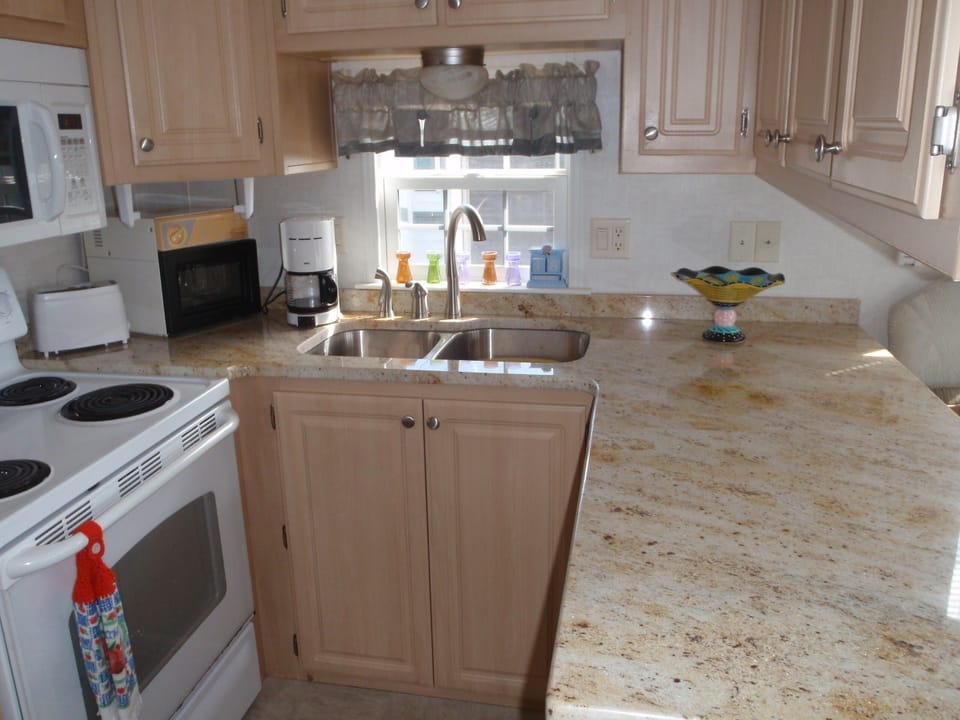 New granite countertops and a new stainless sink and faucet
