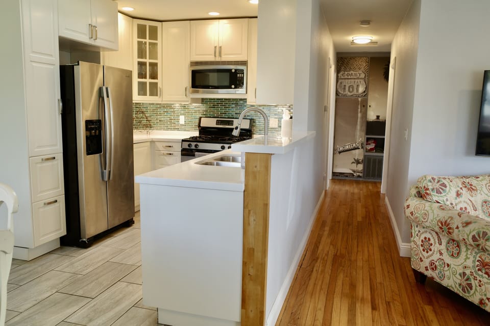 The open kitchen is equipped with all you'd need to cook at home!