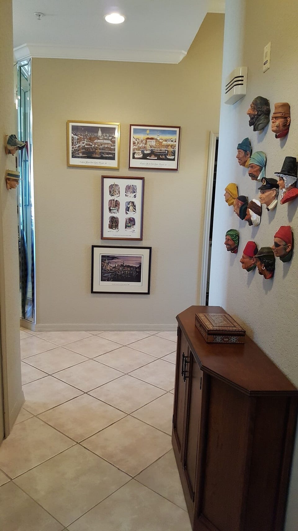 Hall outside guest wing with two bedrooms and bath looking toward entry foyer