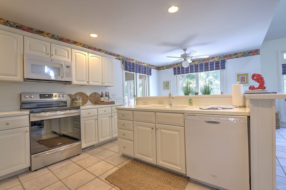 Kitchen Area opening into the Relaxing Screened-In-Porch