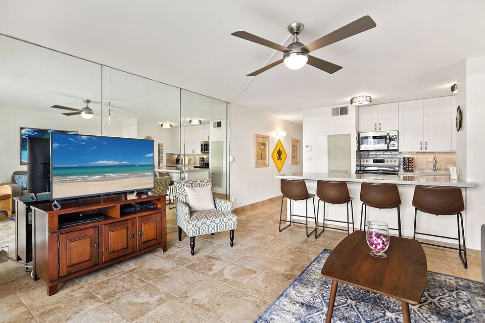 The livingroom area with a 50-inch internet-enabled TV and bar-style seating