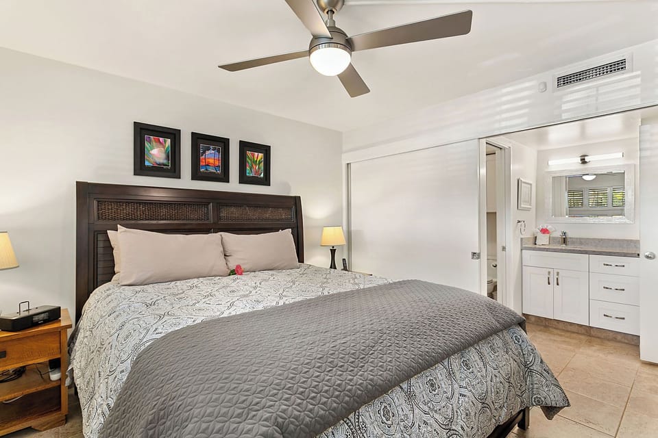 The bedroom is separated from the vanity area by a large sliding door