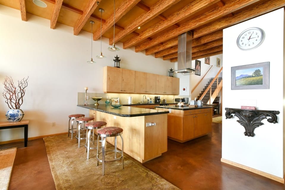 Large open kitchen sits between the living room and dining area