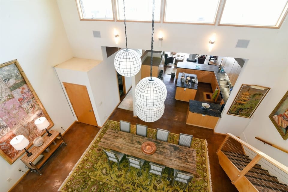 View of the dining area and kitchen from the loft