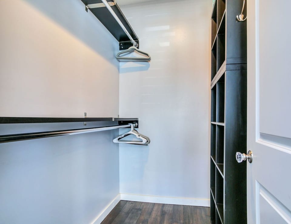 Walk-in master closet with tons of hanging/ storage space