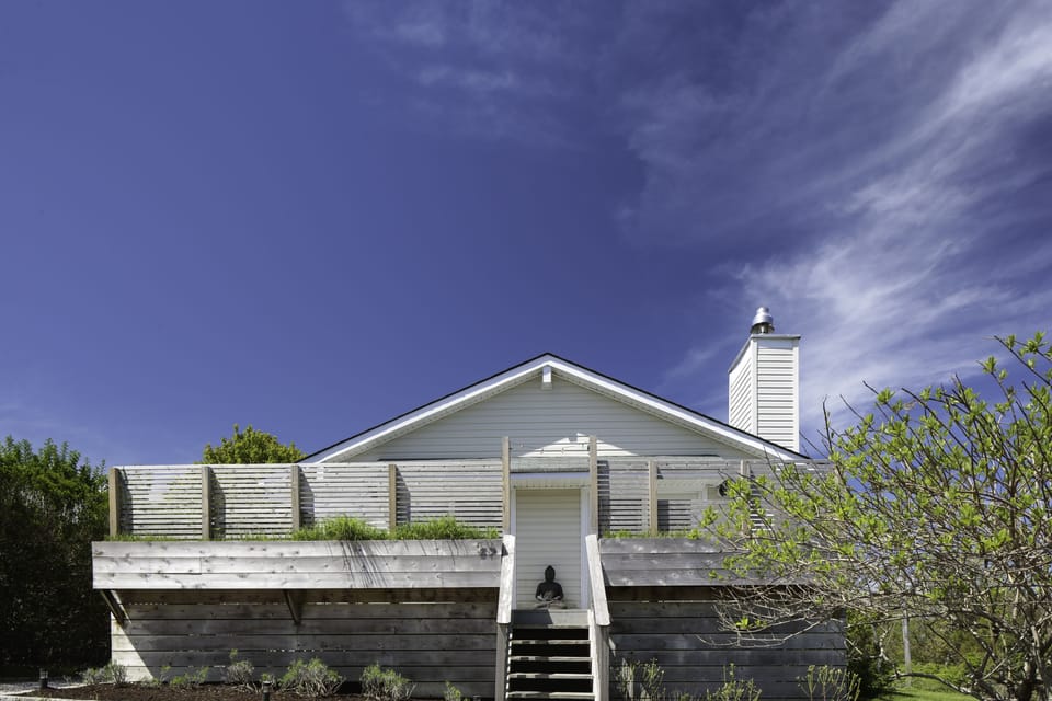 One of staircases leading up to the wrap around deck