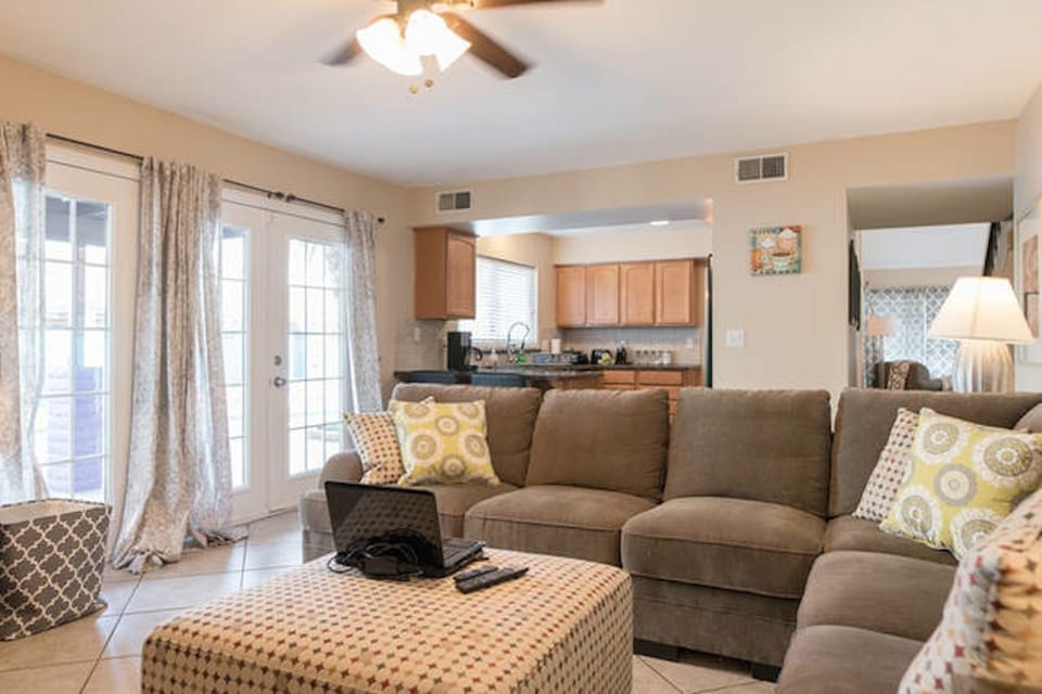 family and kitchen with french doors too pool area