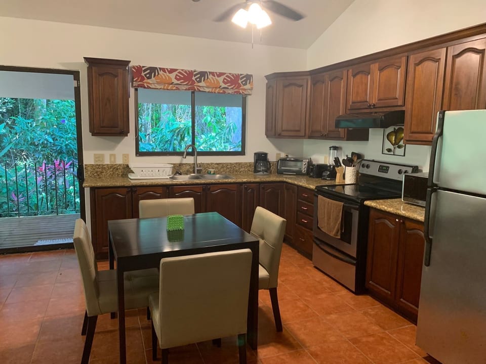 Dining table with 4 chairs.  Sliding glass door out to your private patio.