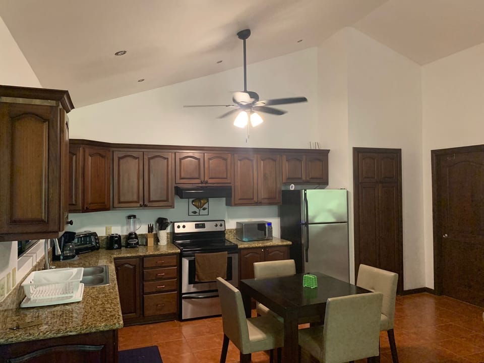 Enjoy cooking your own meals in a fully equipped kitchen. Table and 4 chairs.  