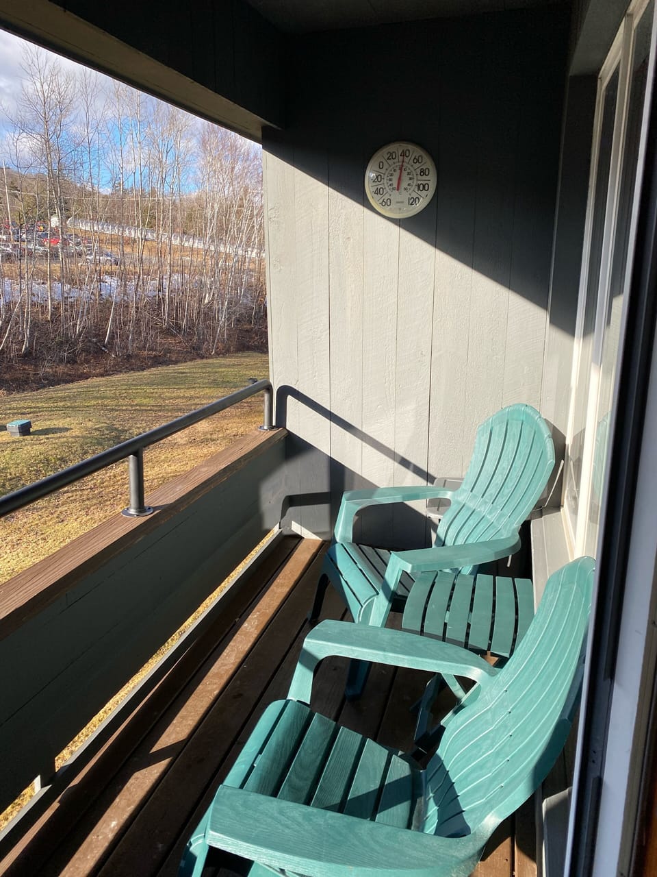 Covered porch facing the ski lodge and sunset