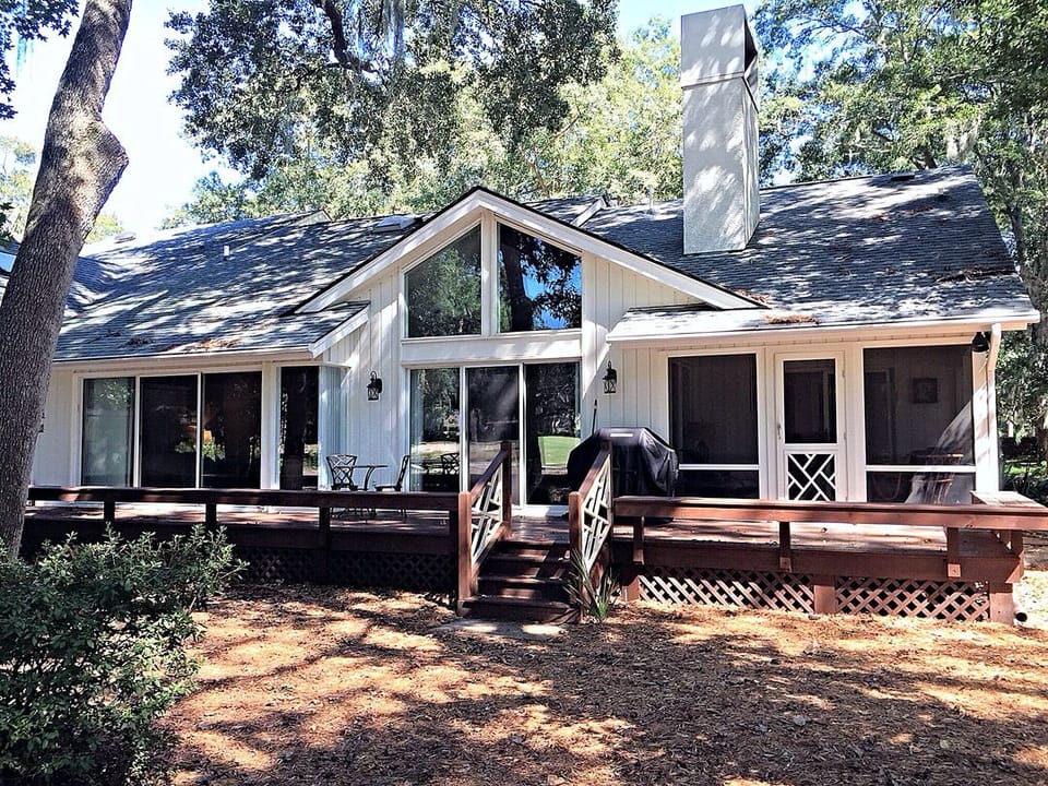 Large deck and screen porch facing golf course.