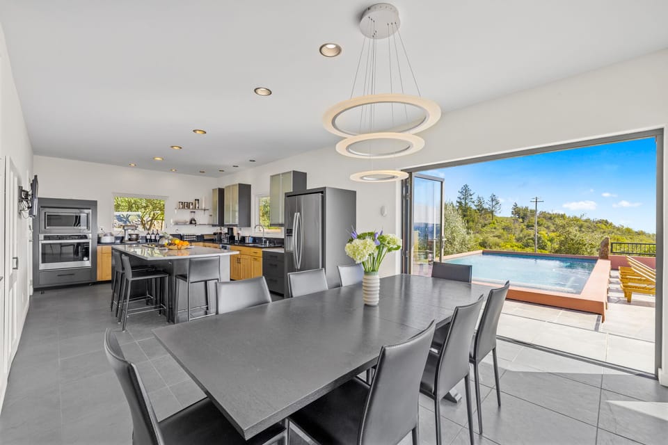 Dining room and deck and kitchen in background