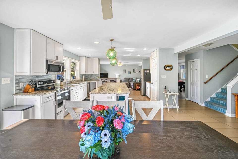 Dining table, looking into the kitchen and living room.