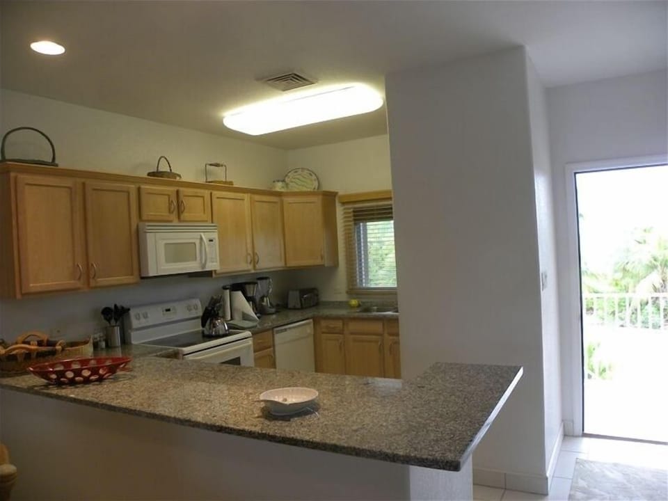FULLY EQUIPPED KITCHEN WITH GRANITE COUNTERTOPS
