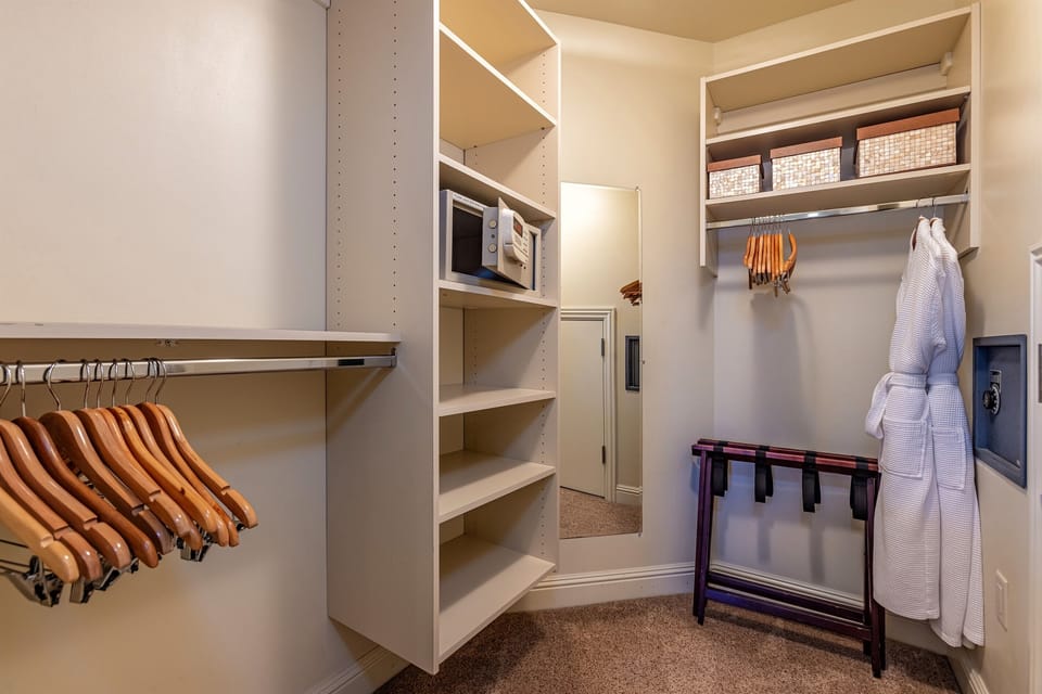 Primary Bedroom contains a walk in closet with safe