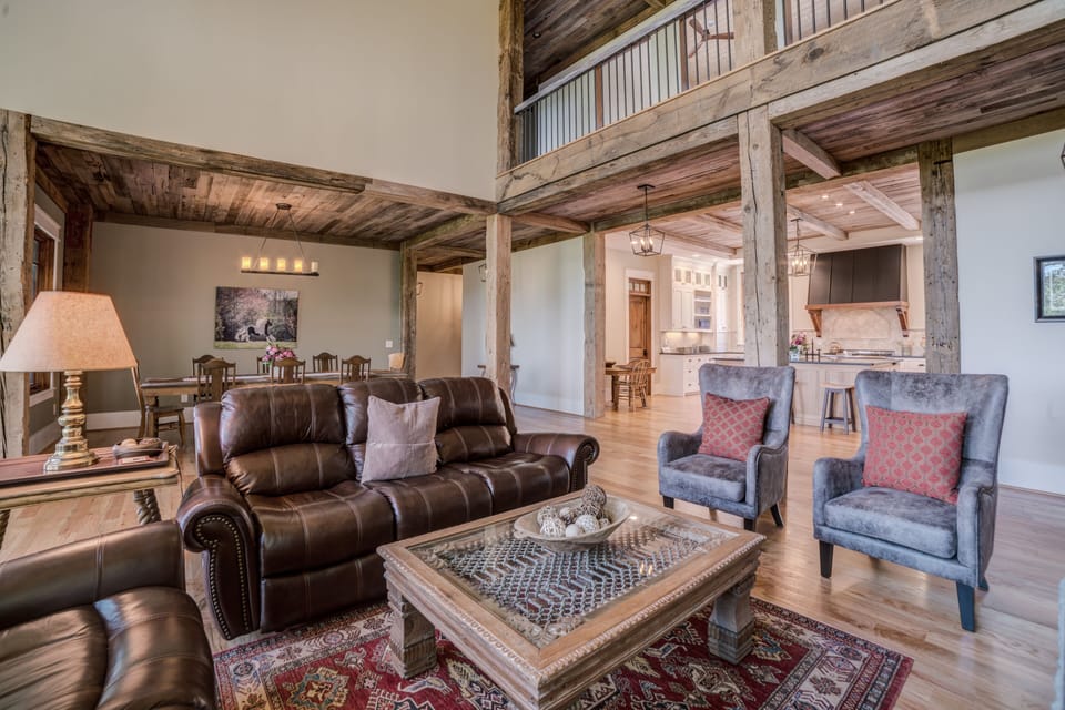 Comfortable seating in front of stone fireplace