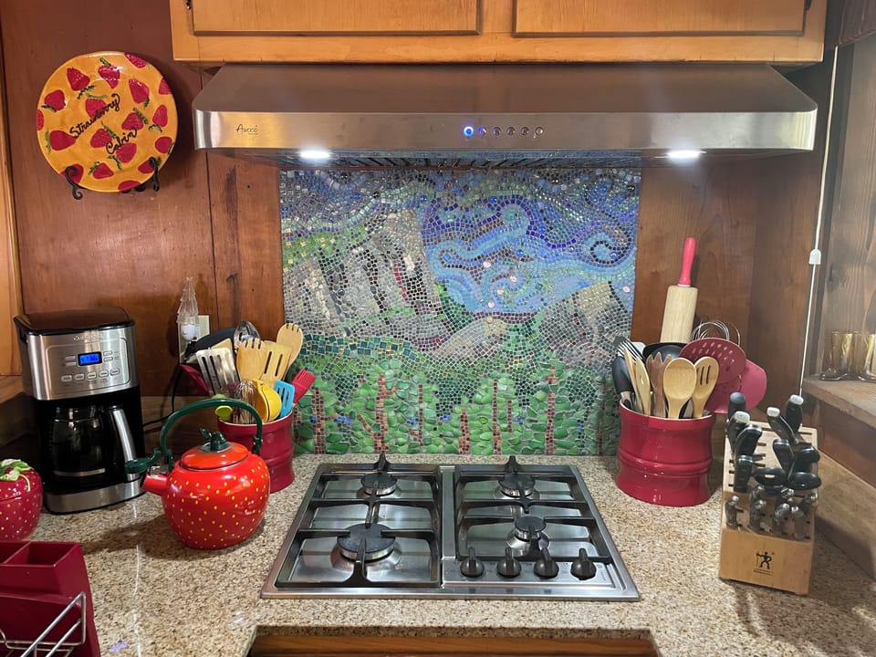 Custom backsplash mosaic of Lover's Leap and Hogsback and cooktop