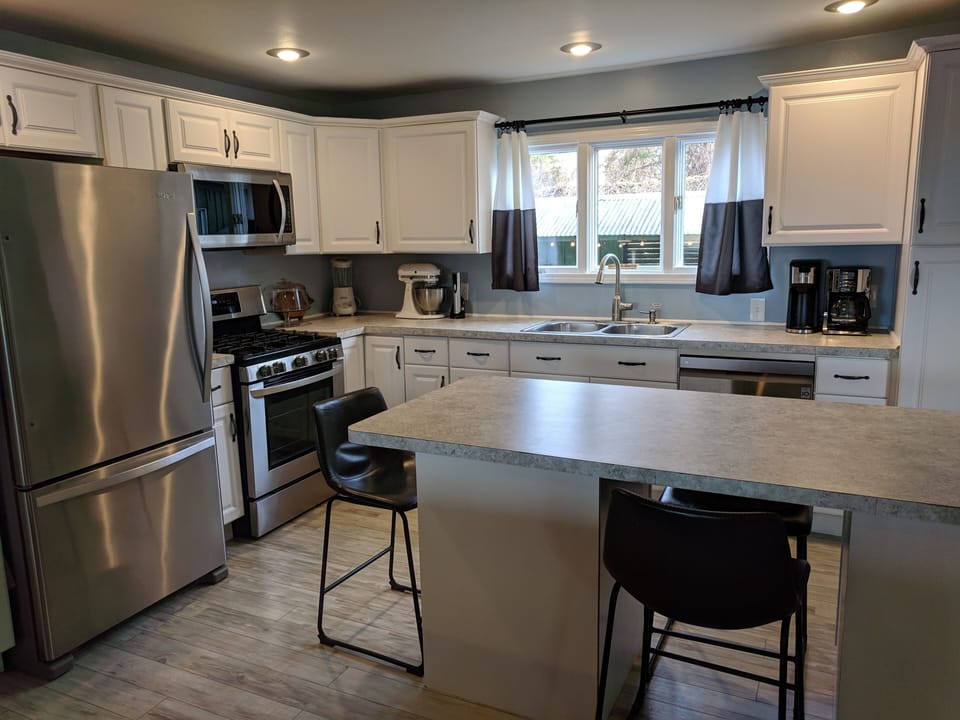 View of kitchen from living room, bright and airy!