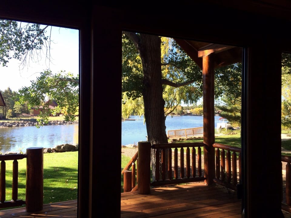 Primary bedroom has beautiful lake views and direct access to the back porch