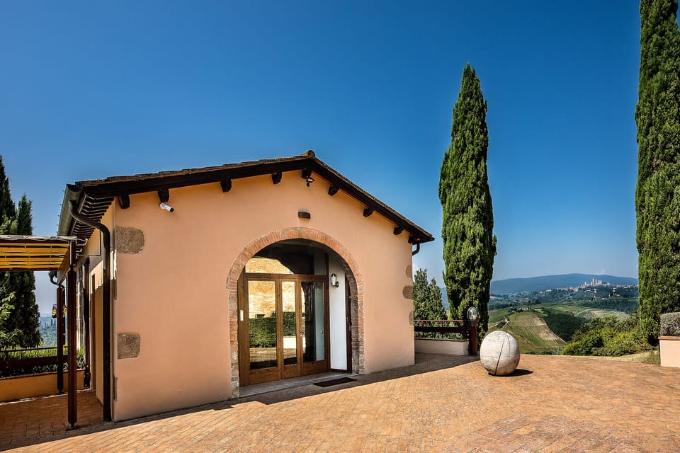Villa's entrance typical Tuscan yard overlooking stunning views 