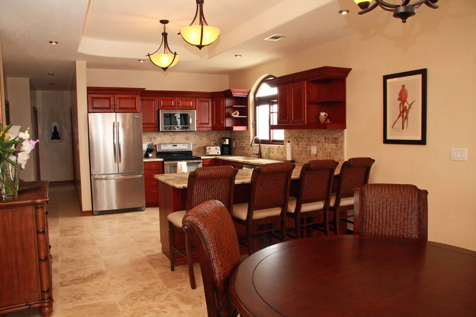 Luxurious and spacious Kitchen. Honduran Mahogany. Gourmet utensils.