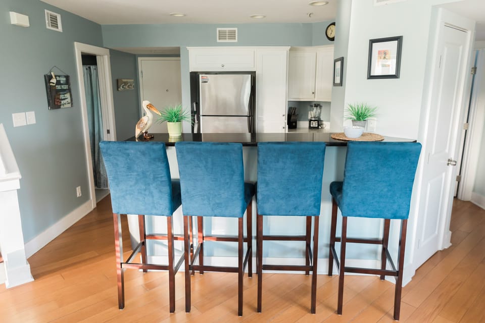Bar and Kitchen, Bathroom is door to left and Entry is door in the middle