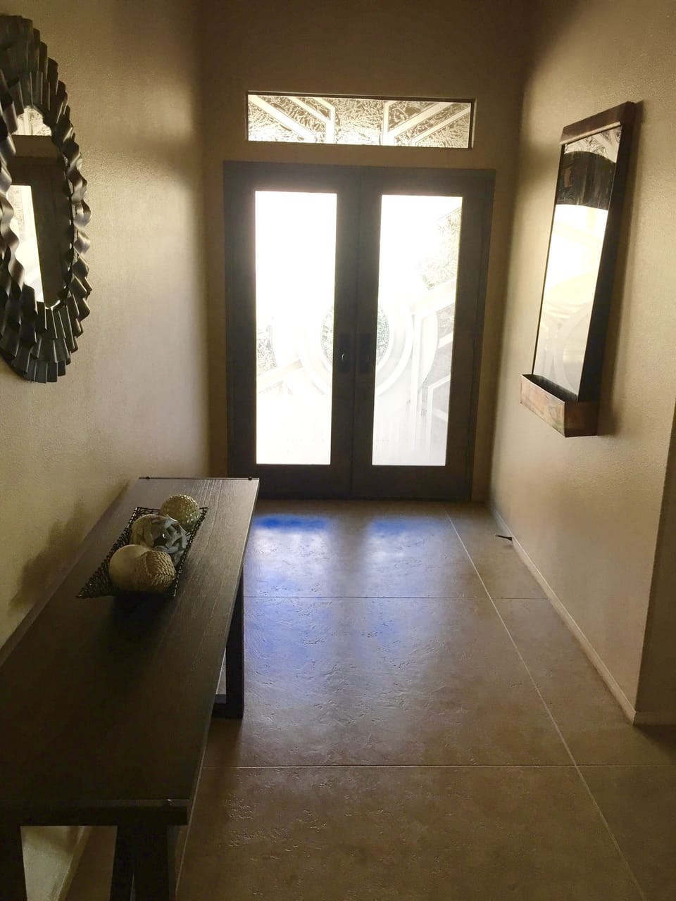 Lovely entryway features a wall mounted water feature
