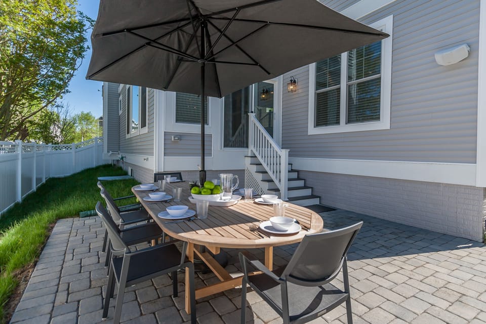 Rear Patio with Seaating and Gas Grill