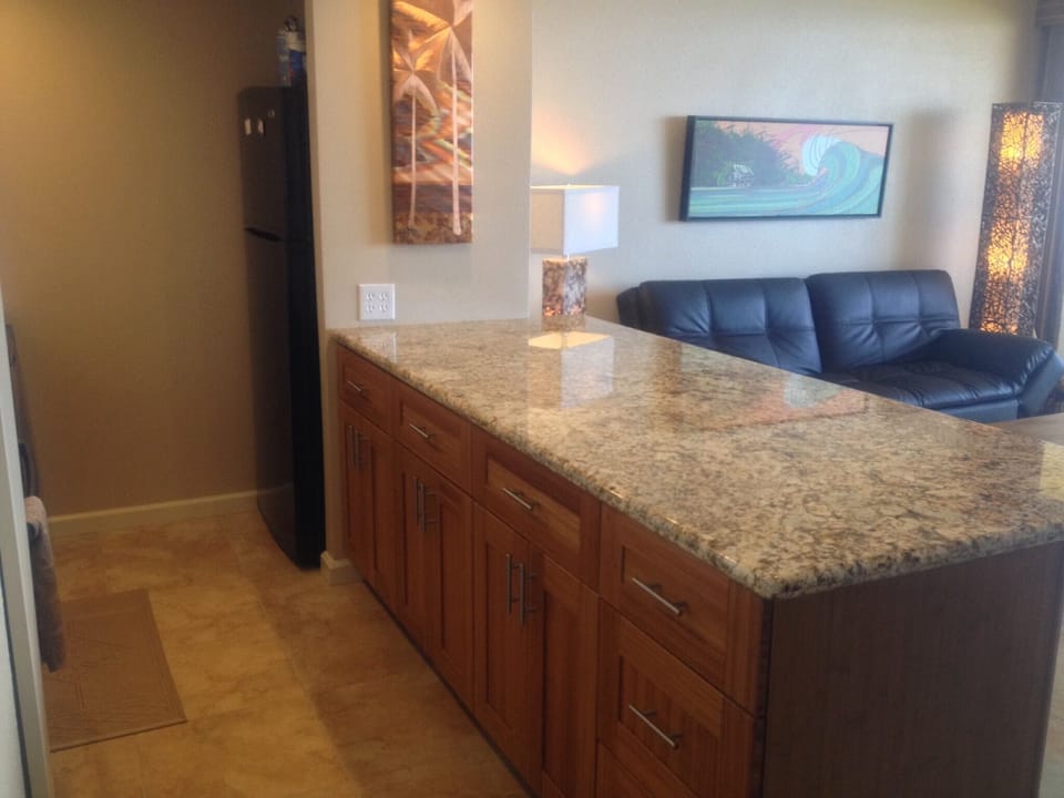 Beautiful bamboo cabinets and a large eat-at island with comfortable bar stools