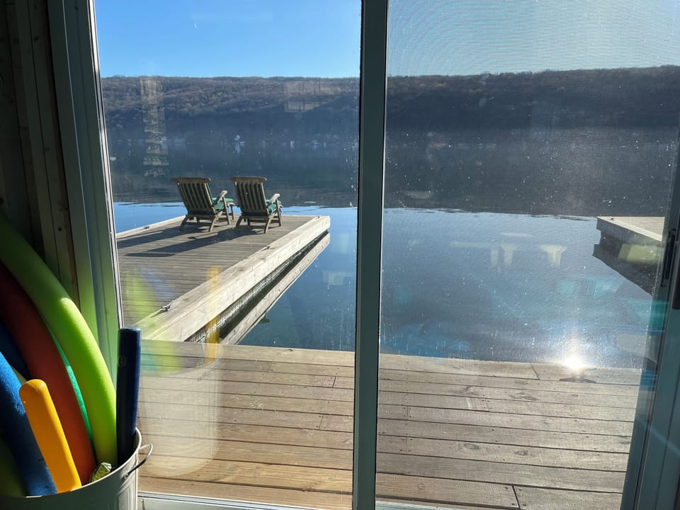View of the lake from the boat house with boat slip