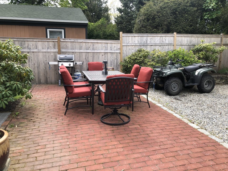 Table has umbrella. 
Sorry, ATV does not come with the house