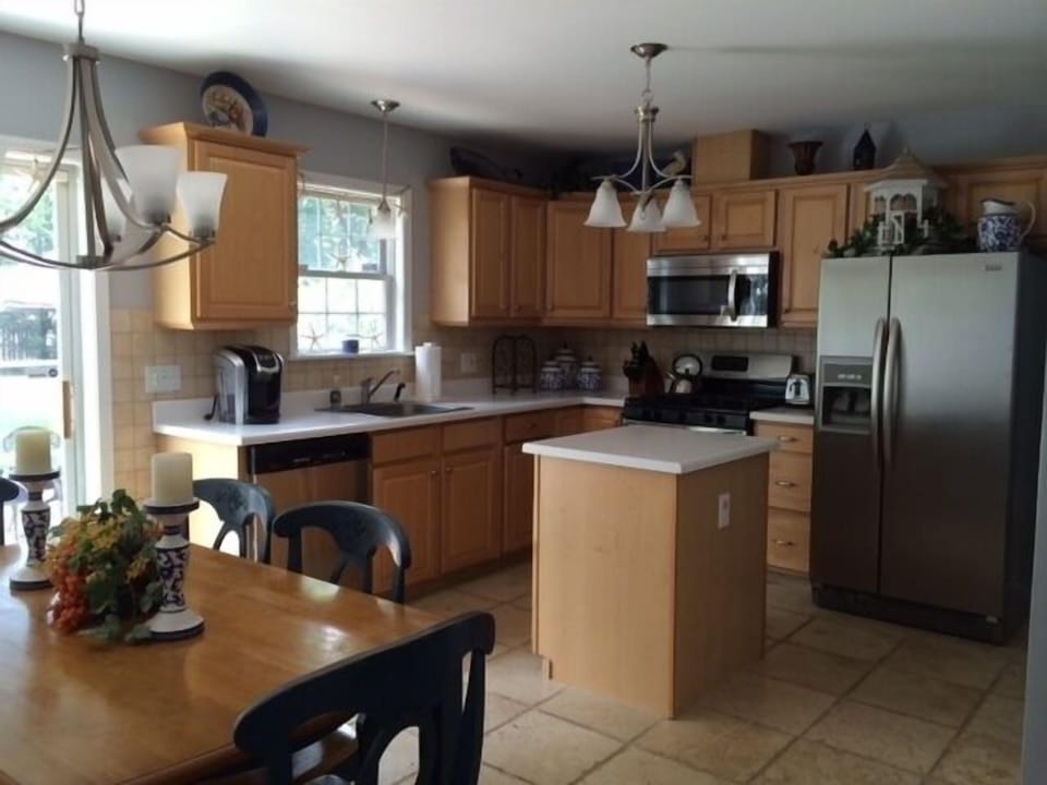 Well appointed eat-in kitchen, out of view, pantry and wine fridge