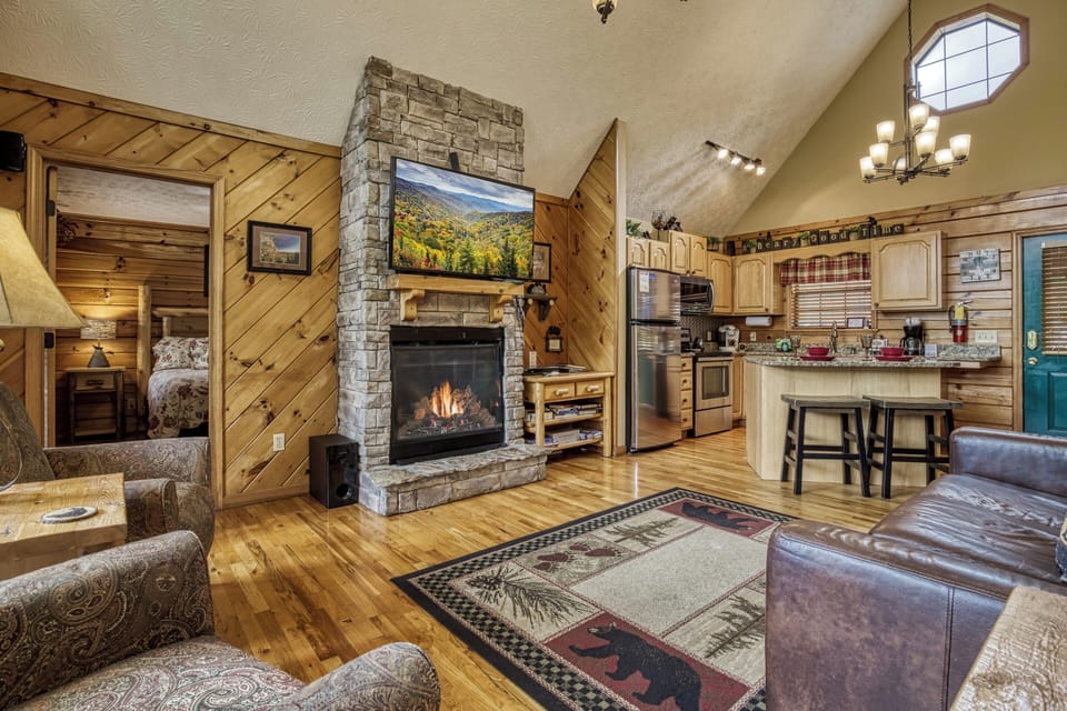 Dollywood Cabin in the Smokies "A Beary Good Time" - Living room with stone encased gas fireplace