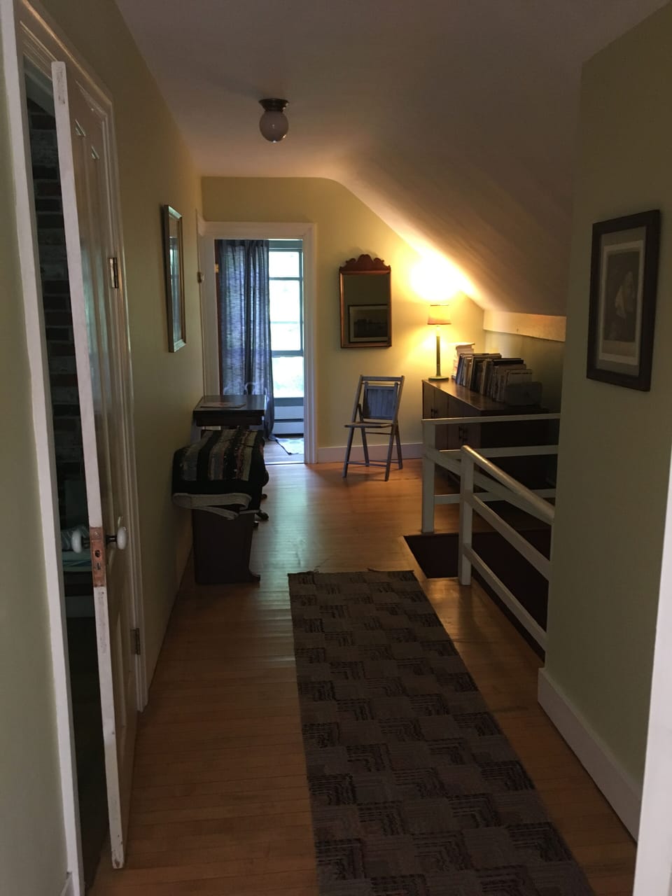 Back 'wing' hallway to two bedrooms and full bath, private stairway to entrance.