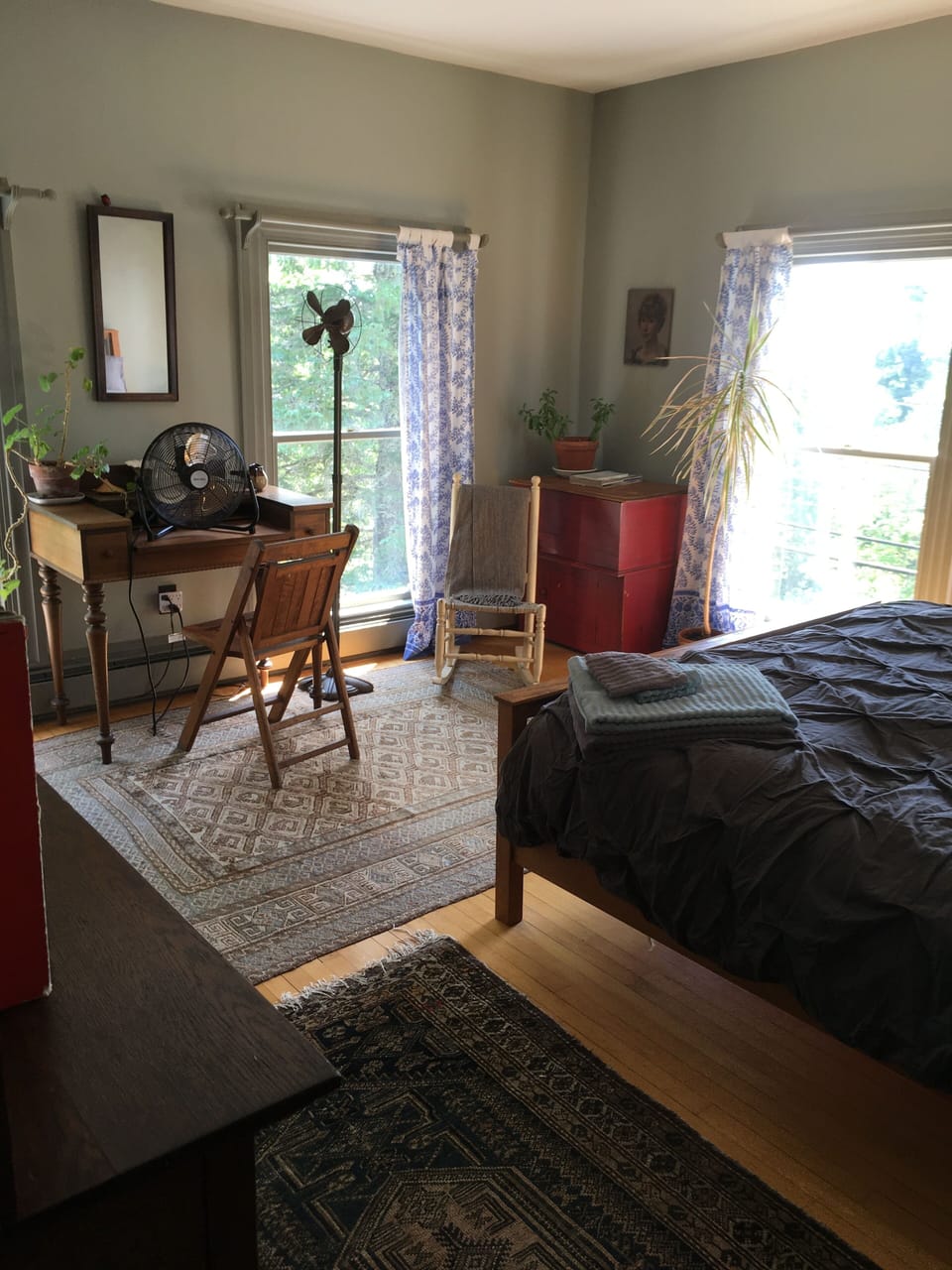 Master bedroom with queen bed, desk, two three dressers, a closet, master bath