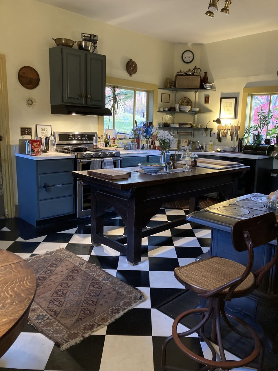 Kitchen, with gas range and double oven, dishwasher, fridge, and cooking tools