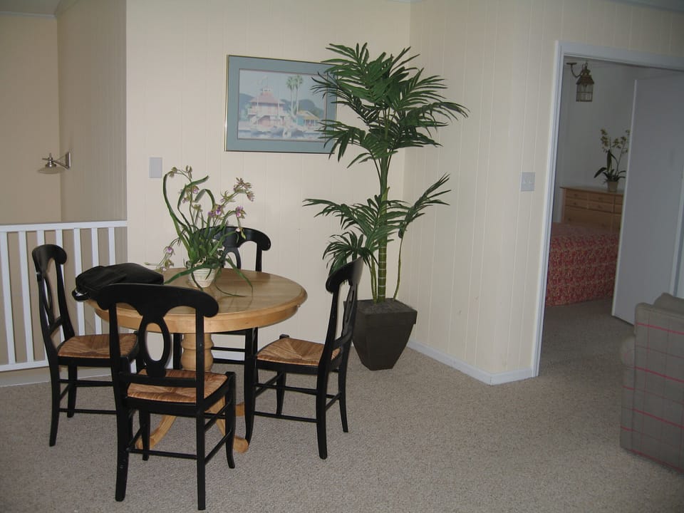 card table and view into master bedroom
