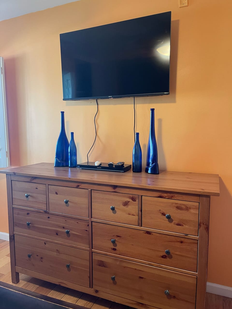 Guest bedroom dresser with smart TV & Blue Ray player 