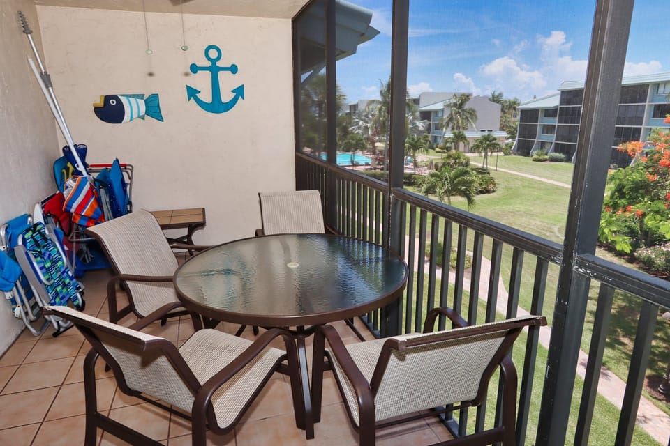 Beach chairs, umbrellas, cart on lanai which opens to living and main bedroom.