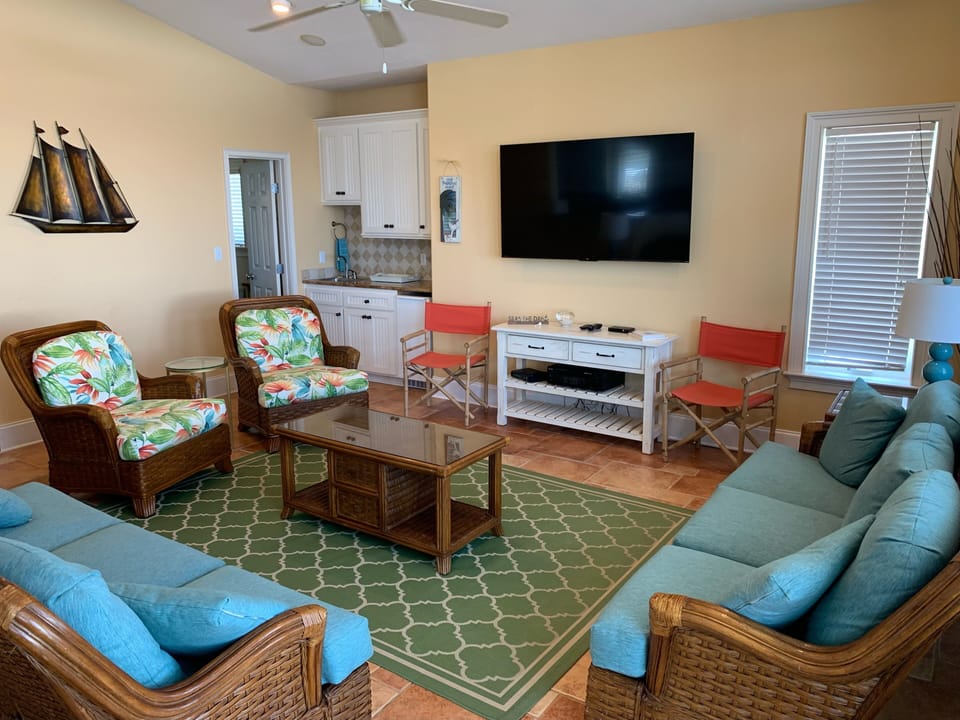 Family Room with wide screen TV and wet bar.